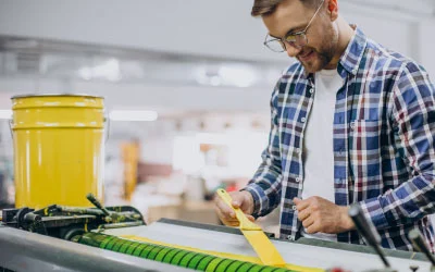A man is doing screen printing