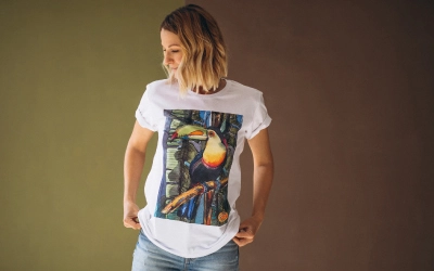 A variety of t-shirts hanging on a rack