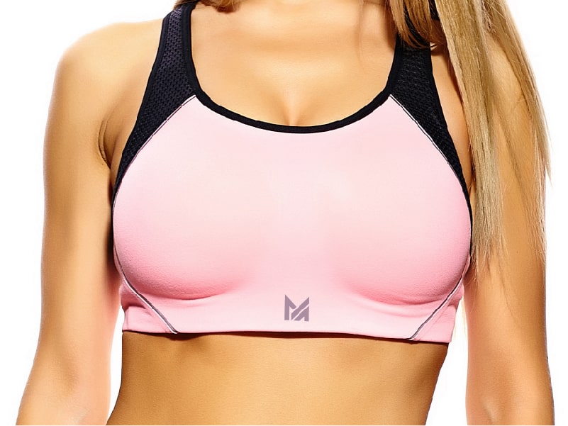 A white denim jacket hanging on a wooden hanger